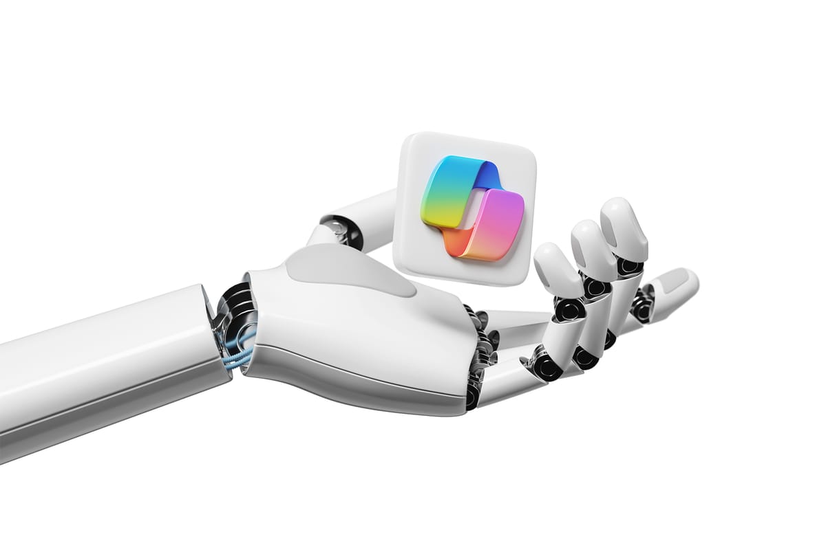 A robotic hand holding a levitating Microsoft Copilot logo